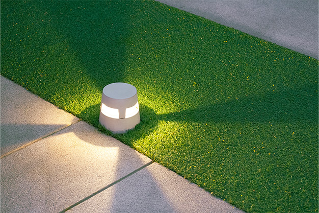 Artificial Turf and Stone Walkway in the Evening